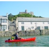 Old style Tarpon 100 being paddled at St Michaels Mount in Cornwall