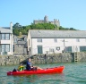 Old style Tarpon 100 being paddled at St Michaels Mount in Cornwall