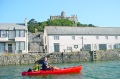 Old style Tarpon 100 being paddled at St Michaels Mount in Cornwall